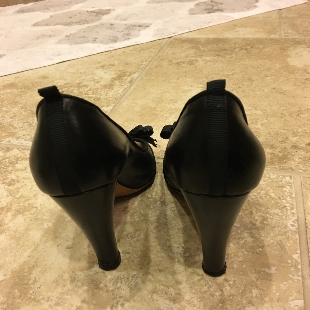 Black peep toe bow pumps