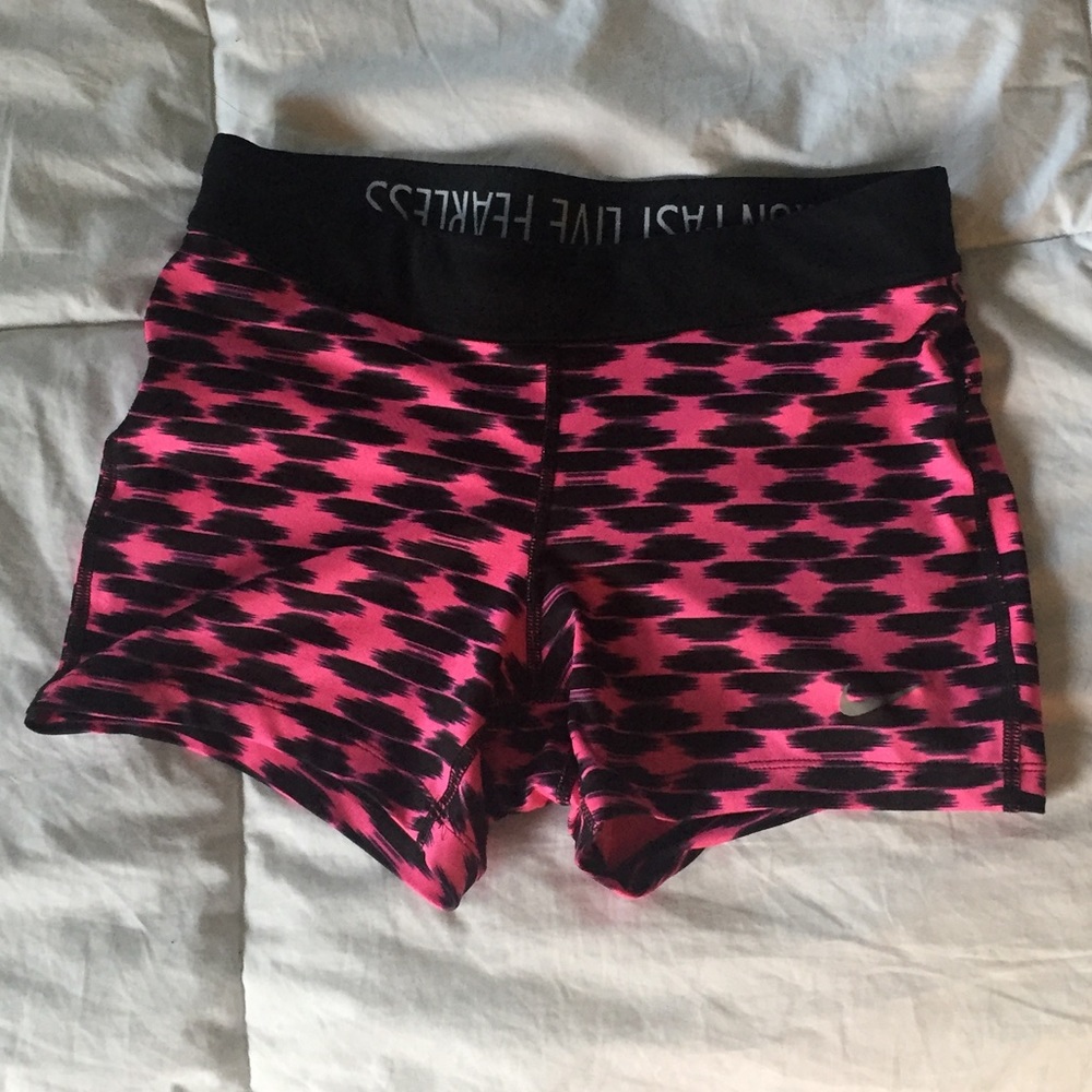 Pink and black Nike shorts
