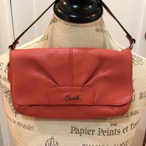 Coach wristlet coral color snap closure