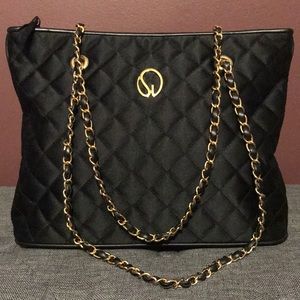 Authentic black St. John quilted shoulder bag.