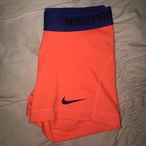 Authentic neon orange Nike Pros