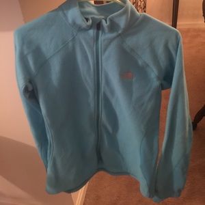Light blue North face zip up. Worn once. Size med