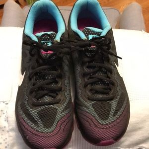 Black with blue and pink nike shoes
