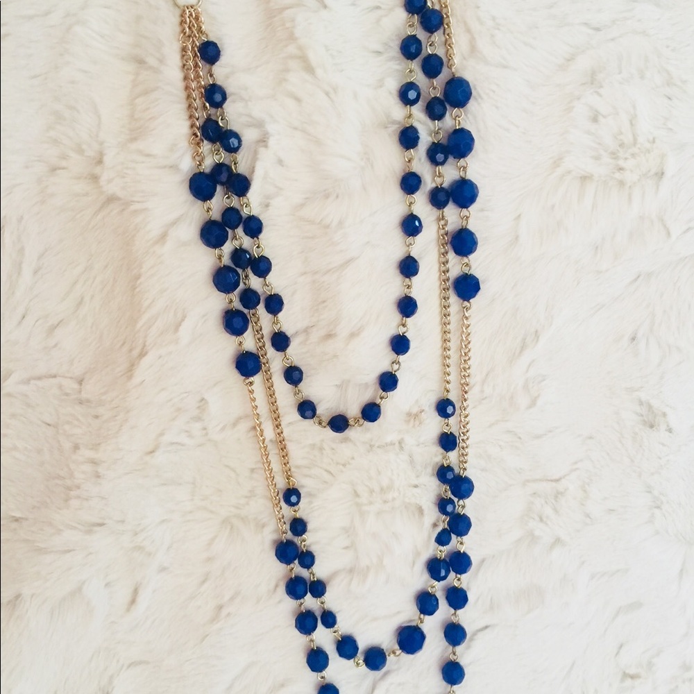 Blue beaded and gold chain necklace.