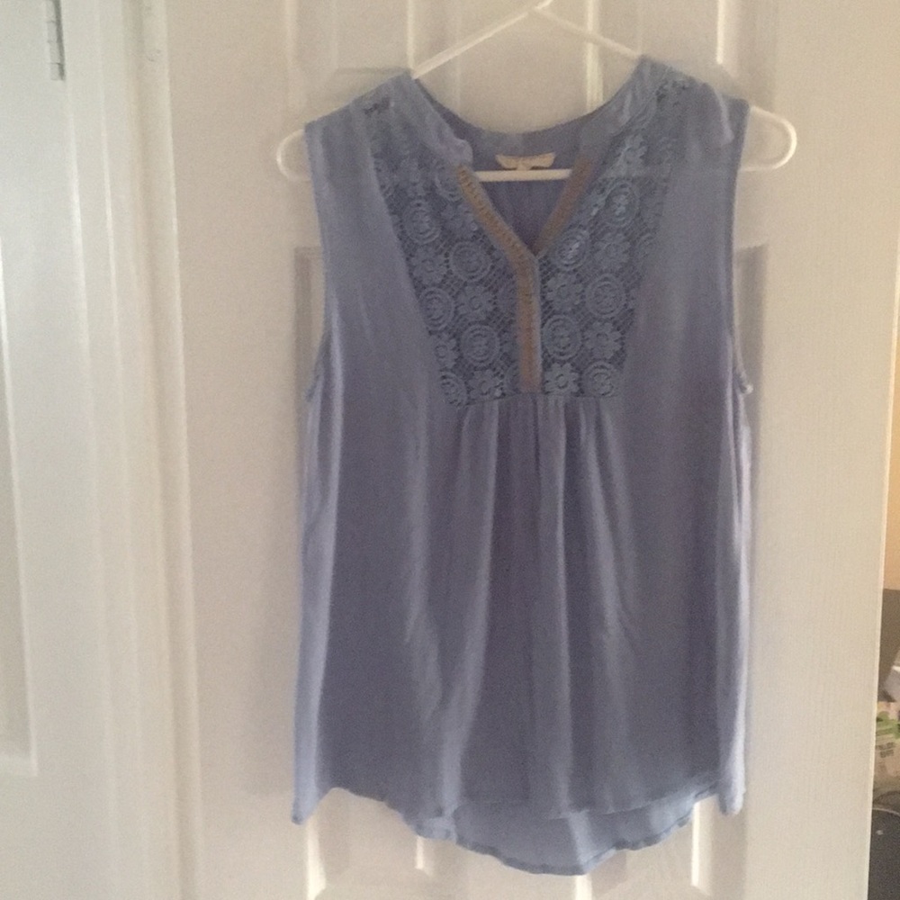 Short sleeve flowing blouse. More like med fit.