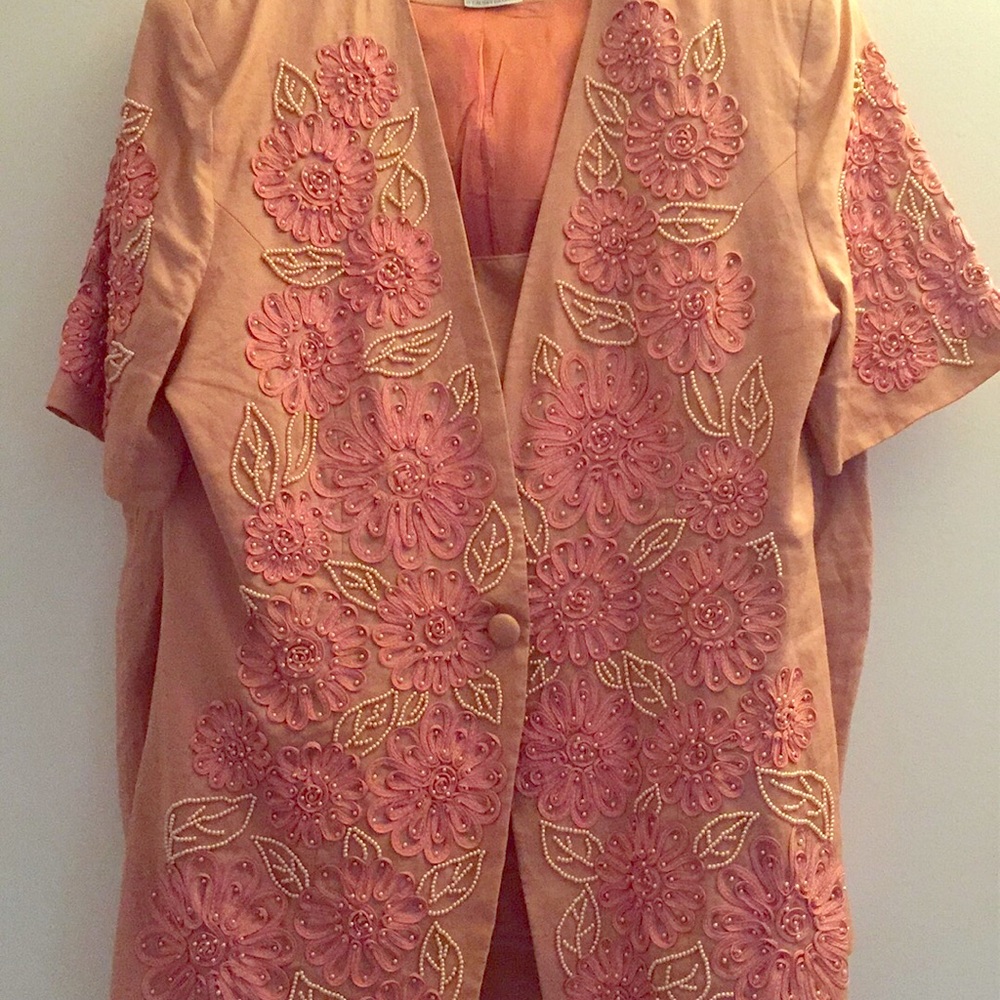 Three piece beaded suit. It’s beaded with pearls.