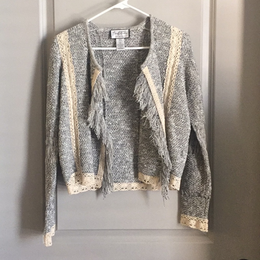 Waist length jacket with fringe detail