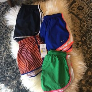 4 pair of Nike/Under Armour workout shorts