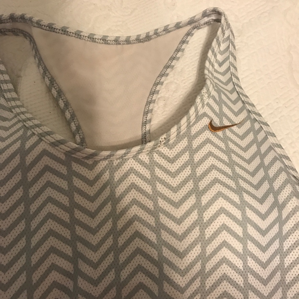 Gray and white Nike tank