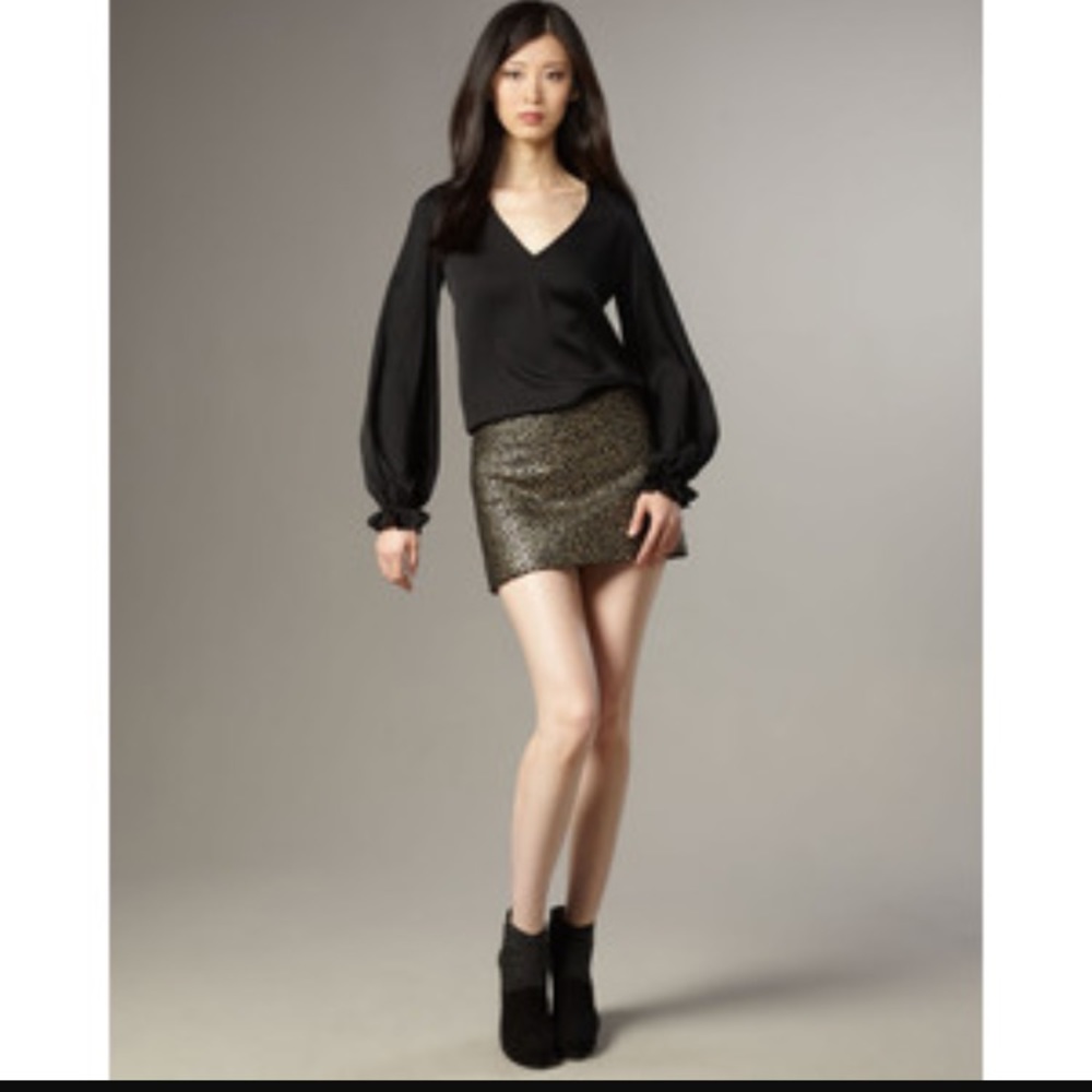 Black mini skirt with gold detail