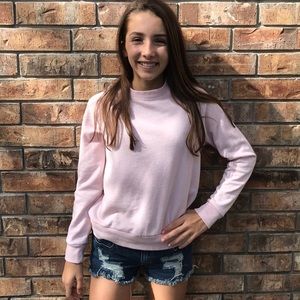 A light pink long sleeve cruise neck t shirt