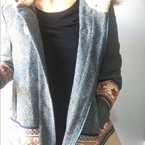 Anthropologie tweed coat with fur lined hood.