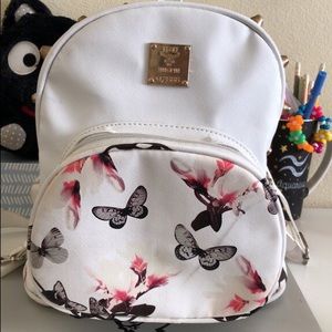 White backpack with butterflies