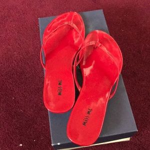 Red patent leather flip flop