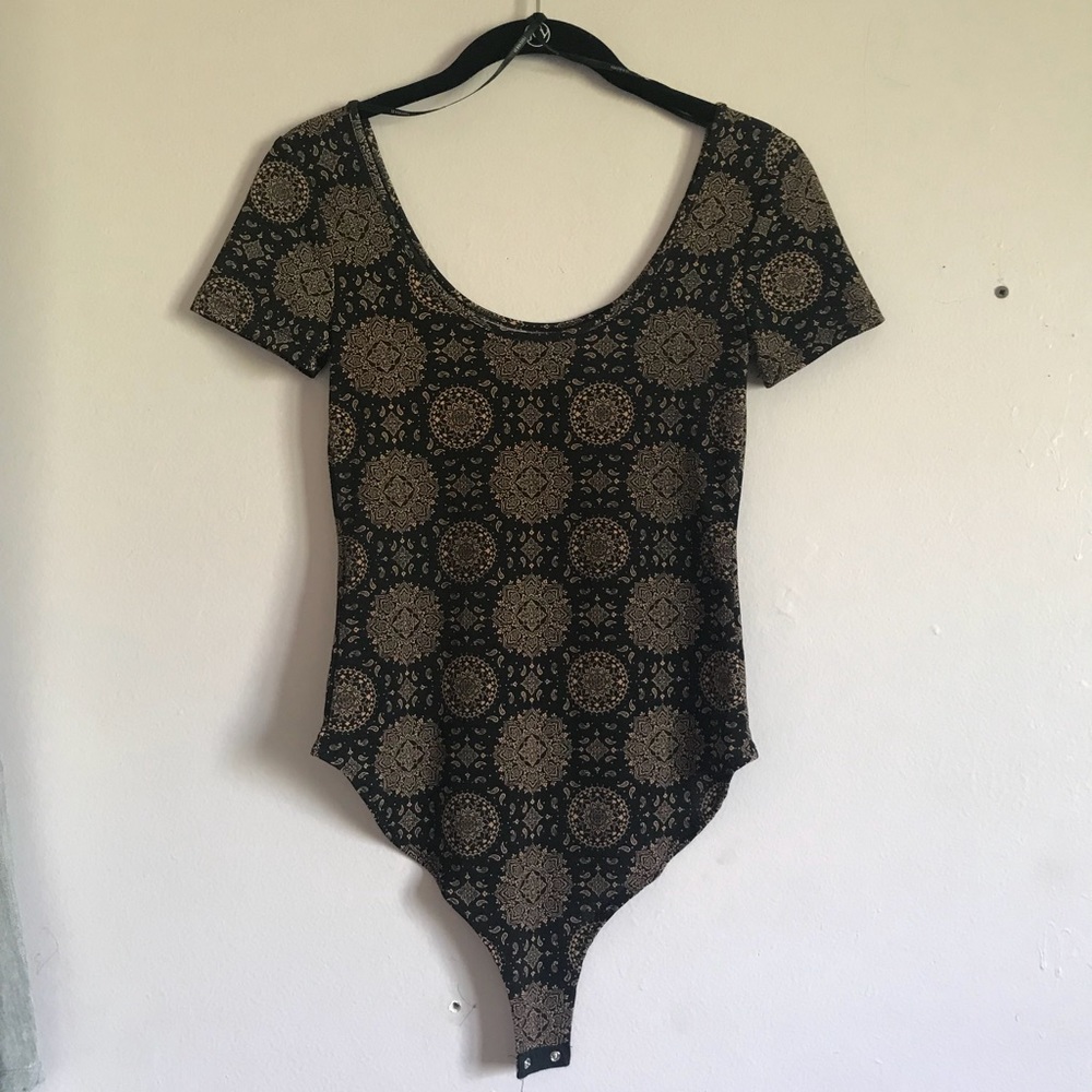 black and gold tribal print body suit