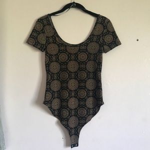 black and gold tribal print body suit