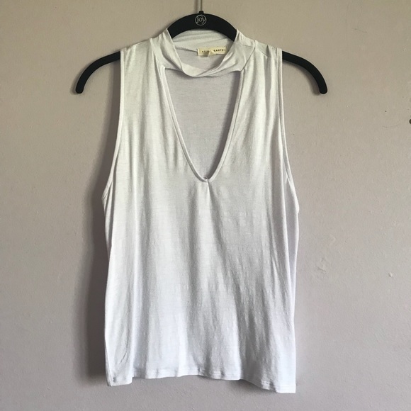 white blouse with a deep neck line - Picture 1 of 3