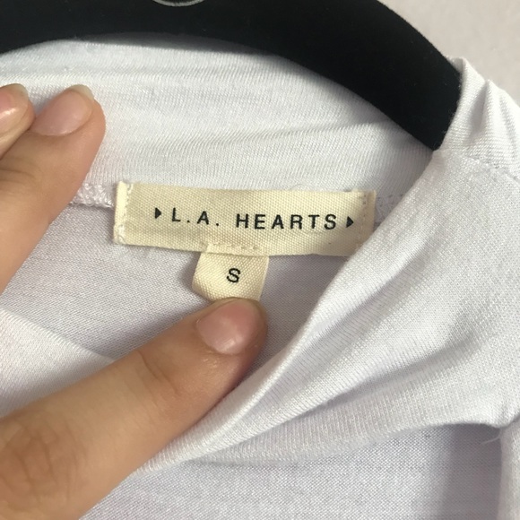 white blouse with a deep neck line - Picture 2 of 3