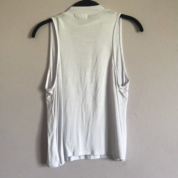 white blouse with a deep neck line - Picture 3 of 3