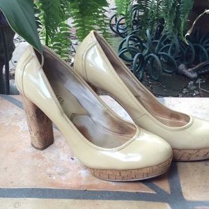 Michael Korrs tan patent leather pumps