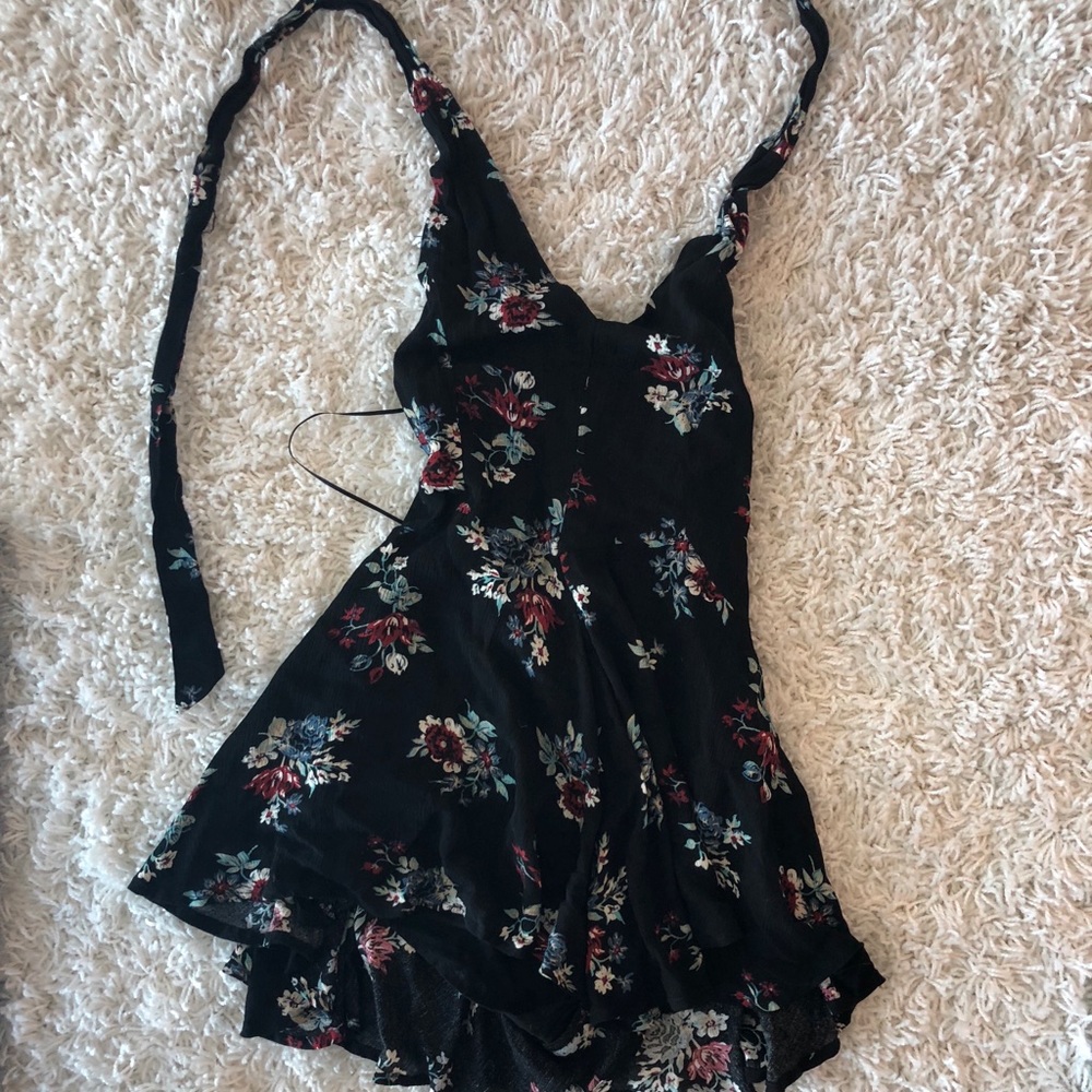 Black floral romper only worn once.