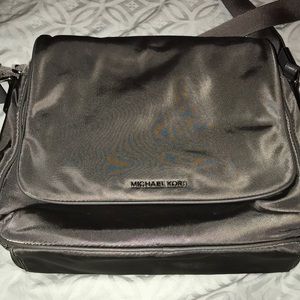 Michael Kors silver messenger bag.