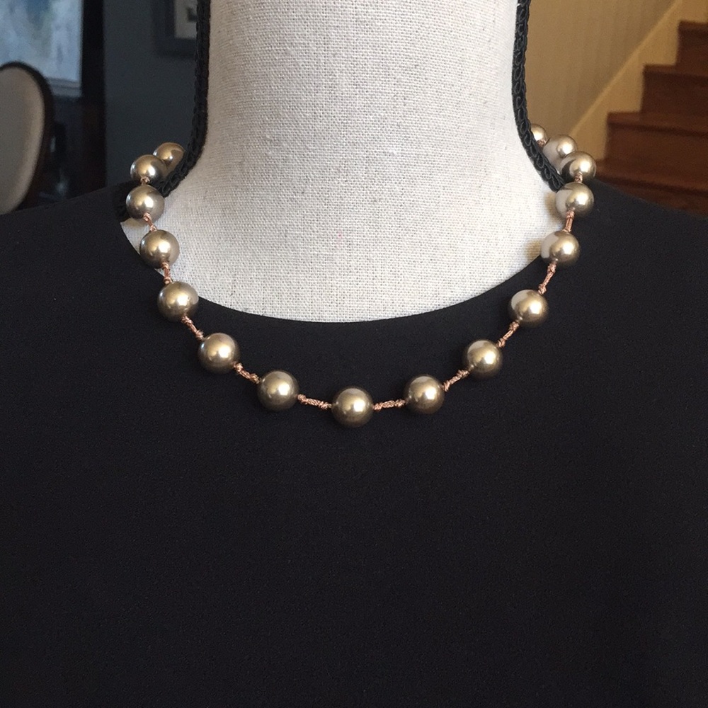 Bronze color beads necklace.