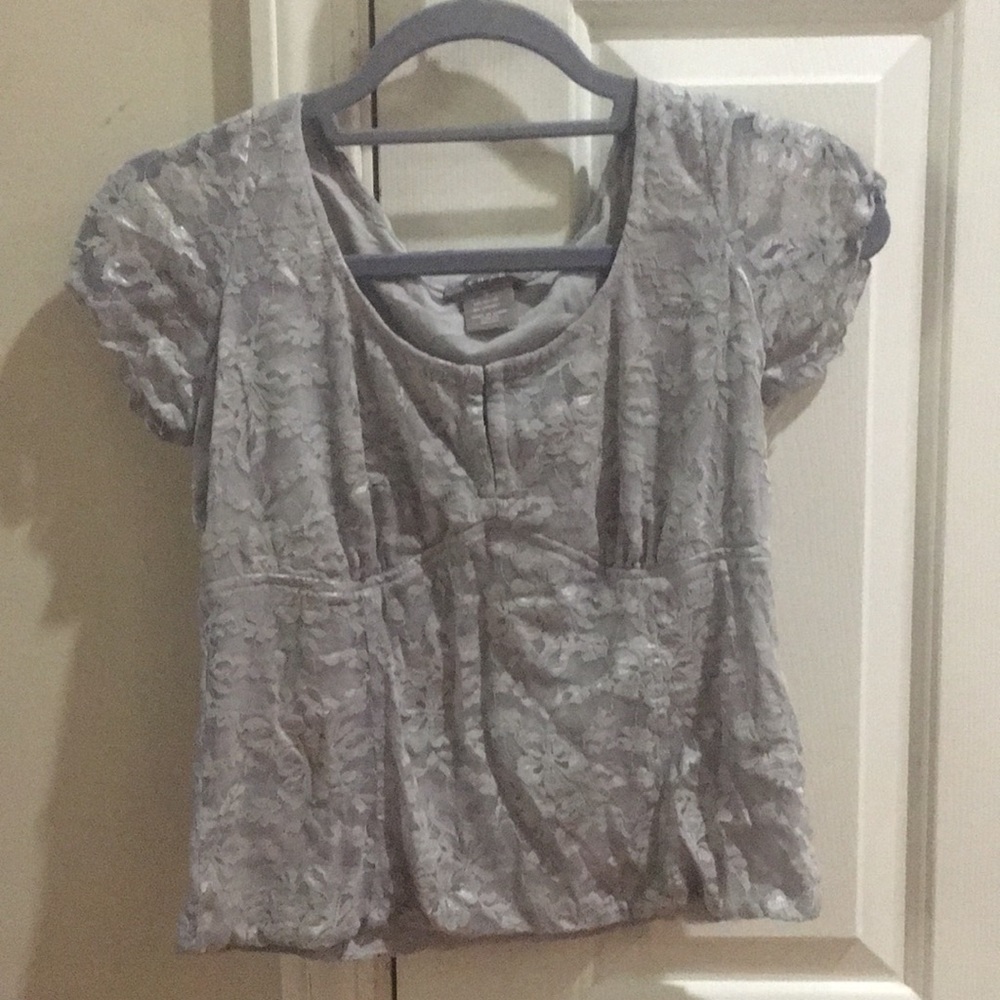A dressy, gray, lace blouse.