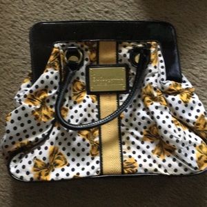 Yellow bow bag with black polka dots