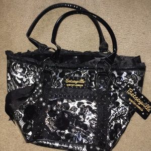 Black floral bag with lace pattern