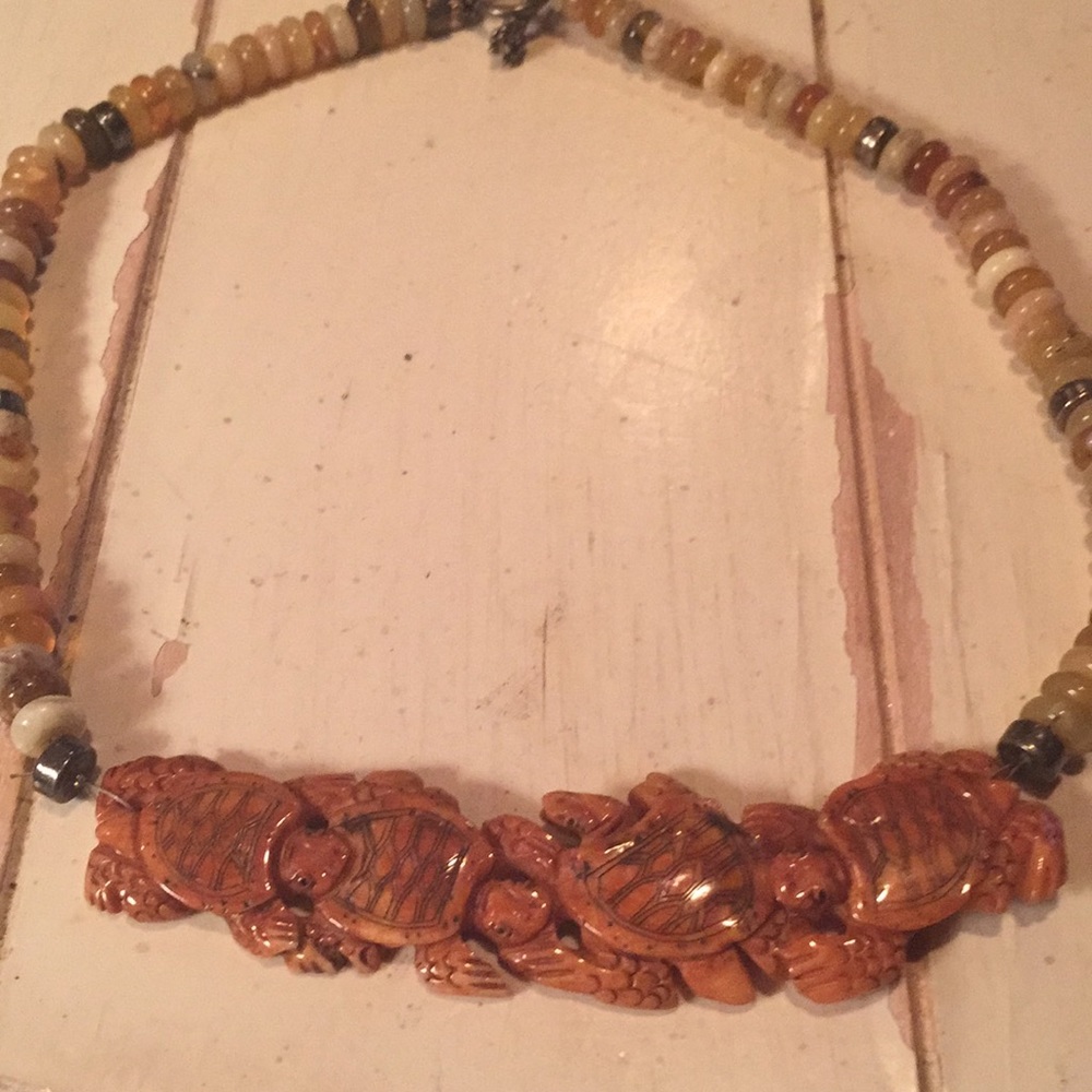 Carved wooden turtles and semi precious stones
