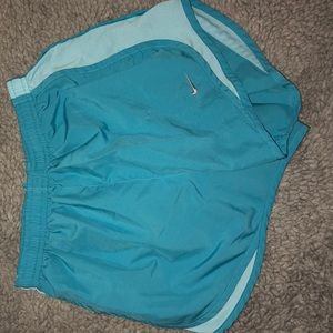 Baby blue Nike shorts.