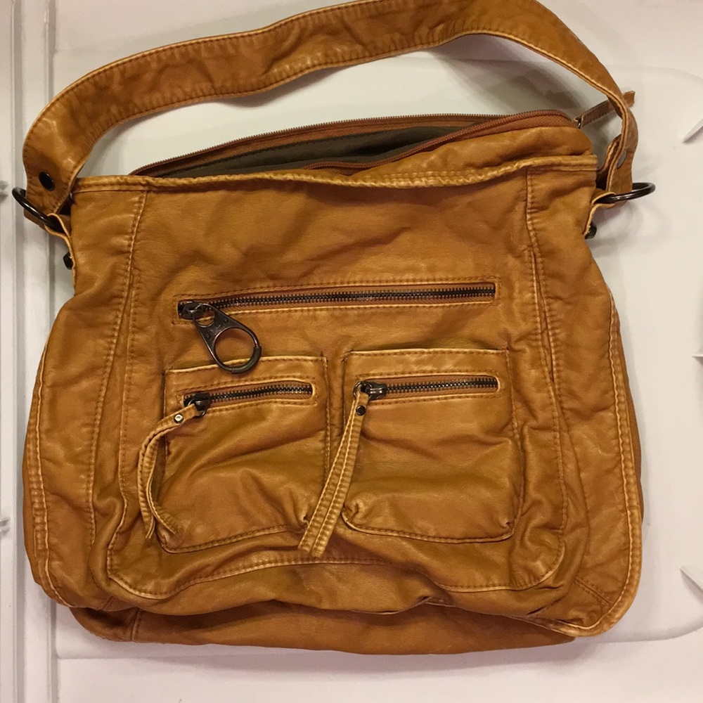Soft tan faux leather bag.