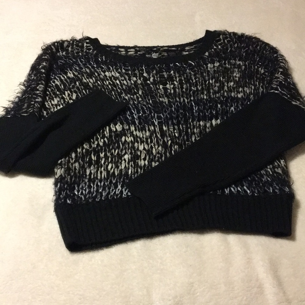 Black grey and silver sweater.