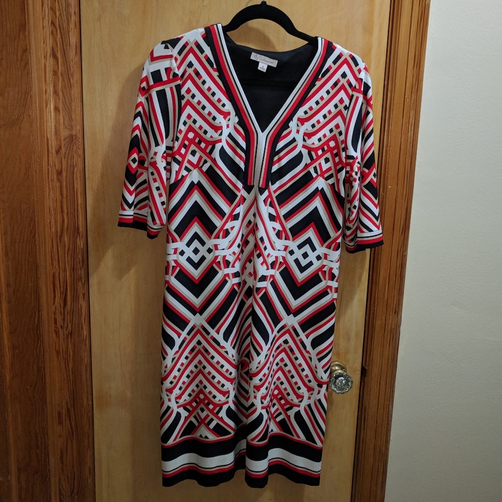 Red, black, white, and tan geometric print dress