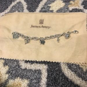 Charm bracelet with 5 different charms.