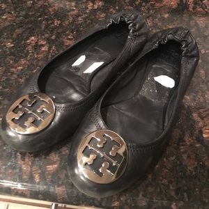 Tory Burch with silver T. Size 10 have been used.