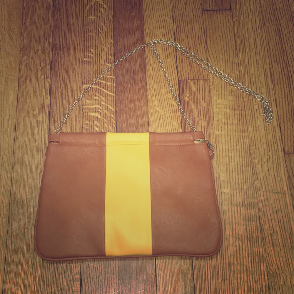 Cognac colored clutch with mustard yellow detail