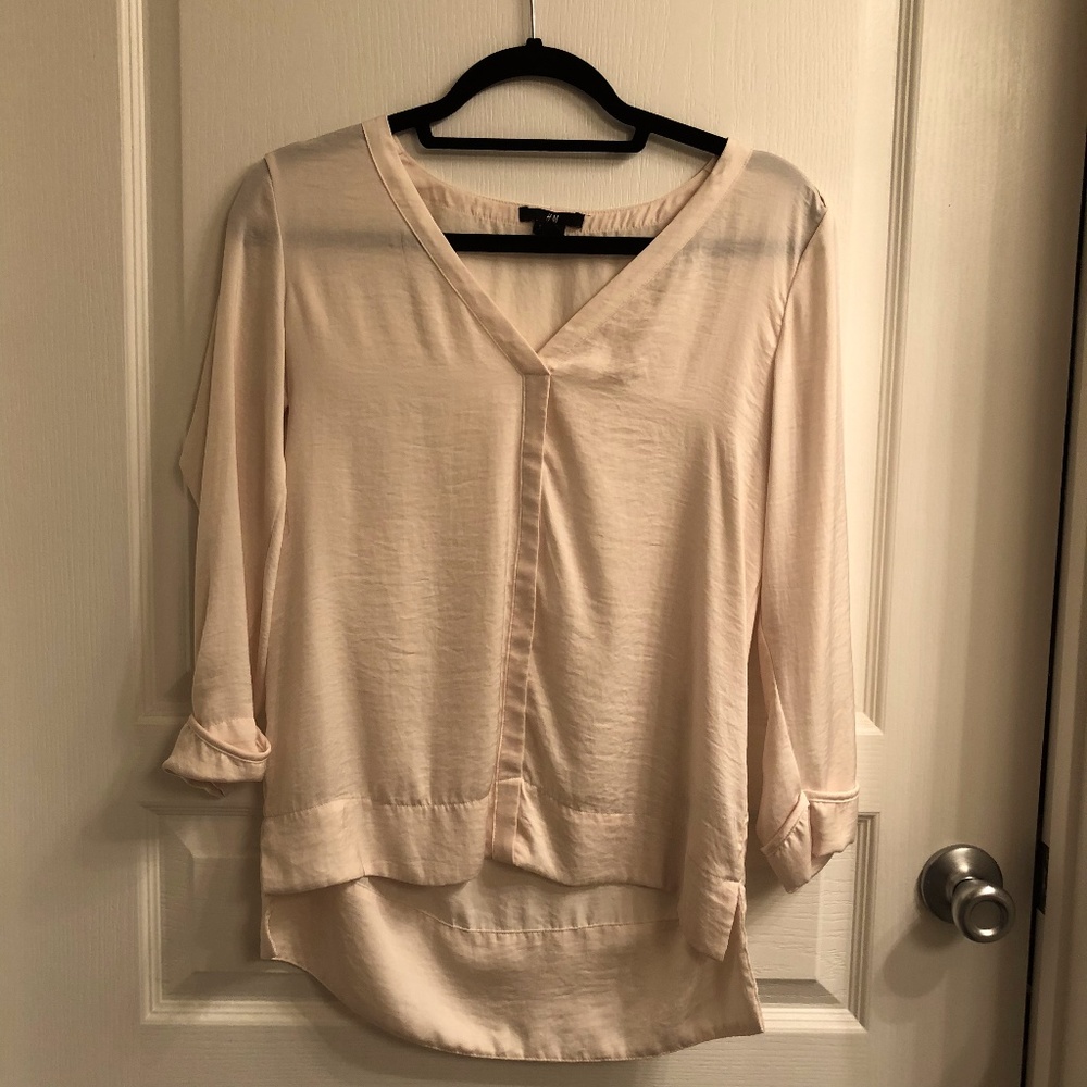 Creme colored sheer top with metal detailing