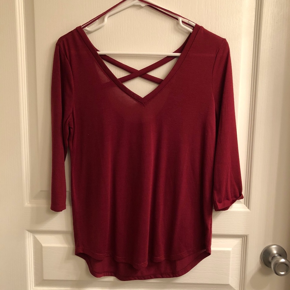 Maroon colored top with criss-cross back