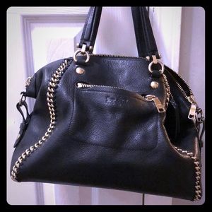 Black Coach purse with gold accents.