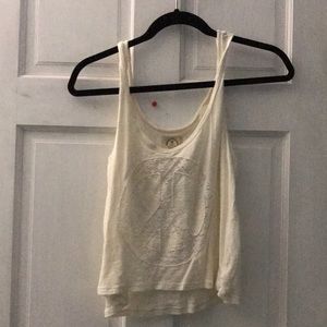 American Eagle cream tank top with lace peace sign