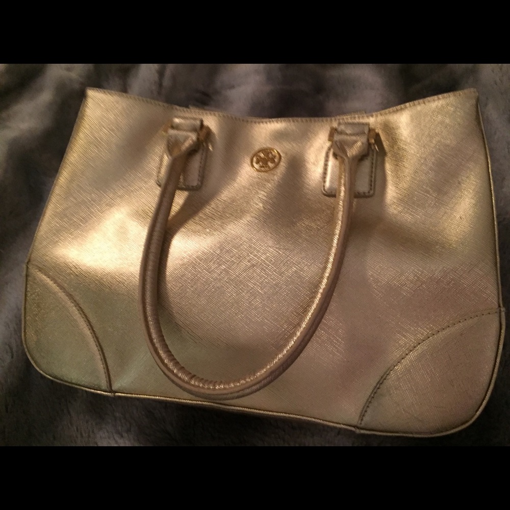 Tory Burch gold metallic handbag.