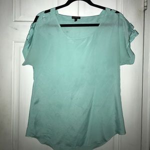 Express teal criss-cross shoulder top.