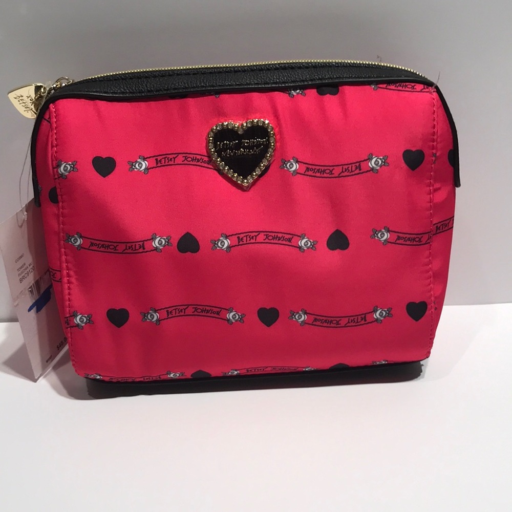 Betsey Johnson hot pink small cosmetic bag.