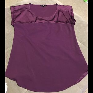 Dark purple silky short sleeve shirt.