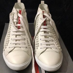 Prada High top sneakers.