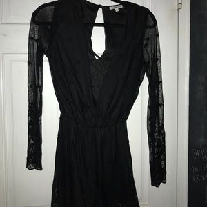 Black cross front, lace sleeve romper.