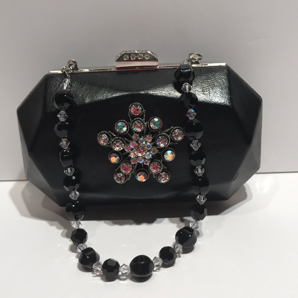 CZ Black clutch with sm strap.