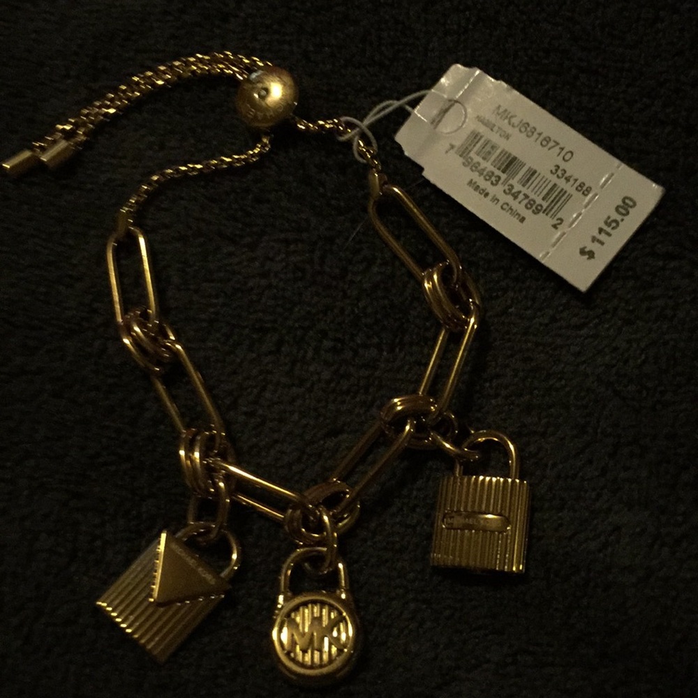 Michael kors bracelet with 3 locks found on purses